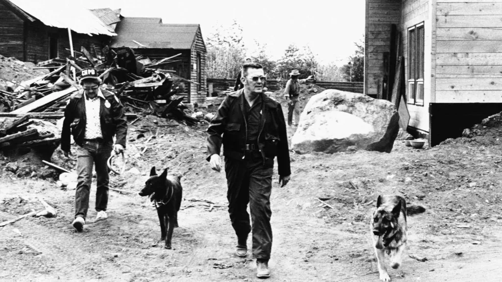 Police and trained scent dogs search the outlying areas for traces of escaped kidnaper Theodore Bundy, Wednesday, June 9, 1977, Aspen, Colo.