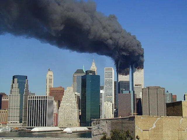 The towers are seen smoking and burning