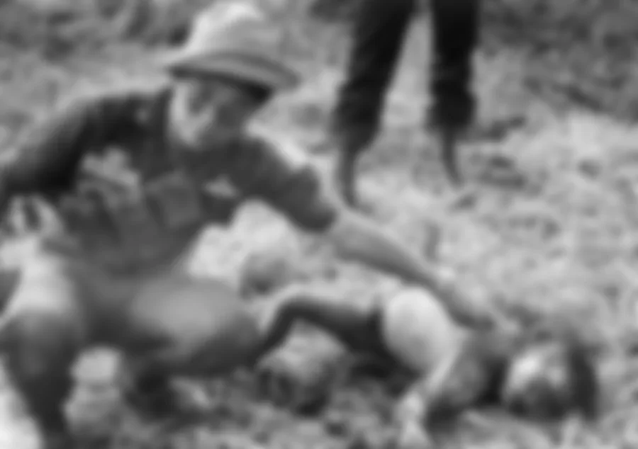A Thai border patrolman finds a dead child that was killed by Khmer Rouge soldiers.
