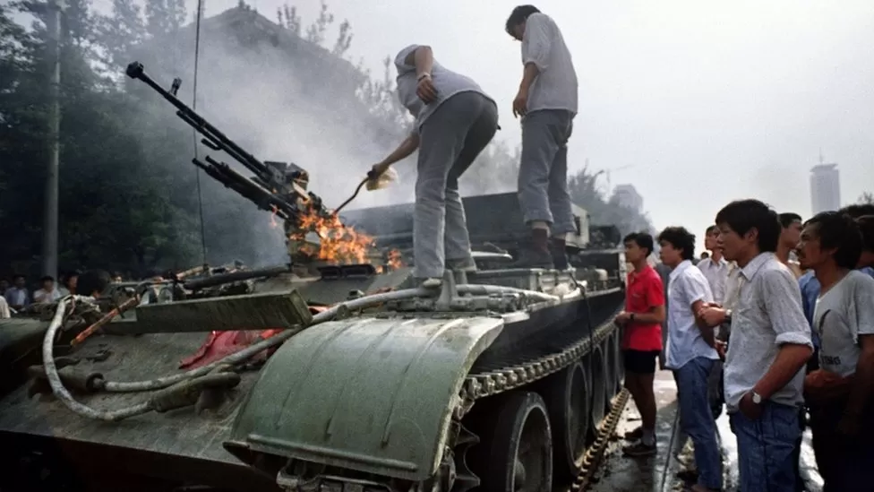A burning armoured personnel carrier (APC) on 4 June 1989, near Tiananmen Square
