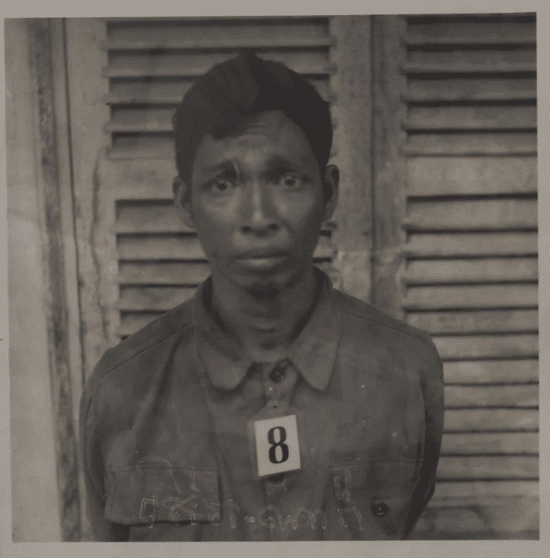 A terrified prisoner is photographed inside the Tuol Sleng prison.