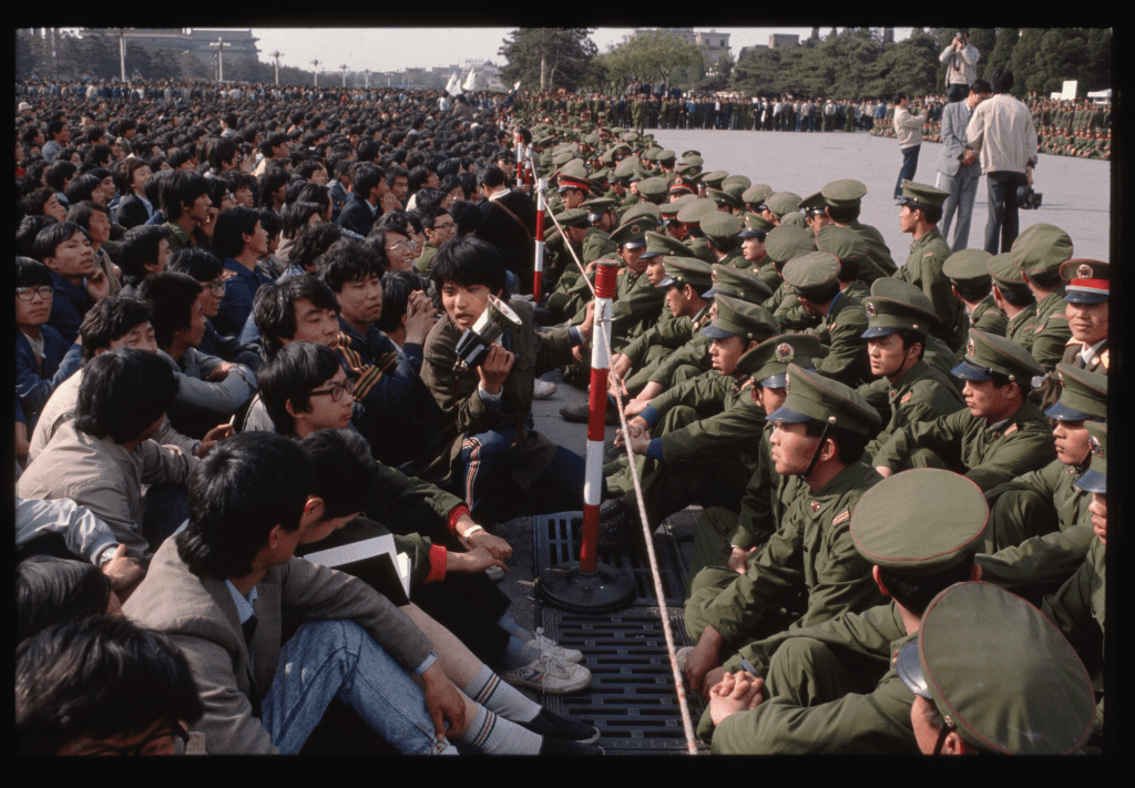 Soldiers keep student demonstrators away from the Hu Yaobang memorial on April 22, 1989
